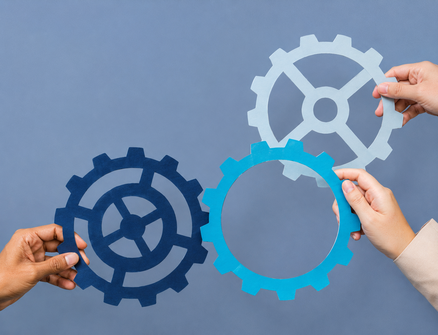 Cogwheel business productivity symbol held by hands